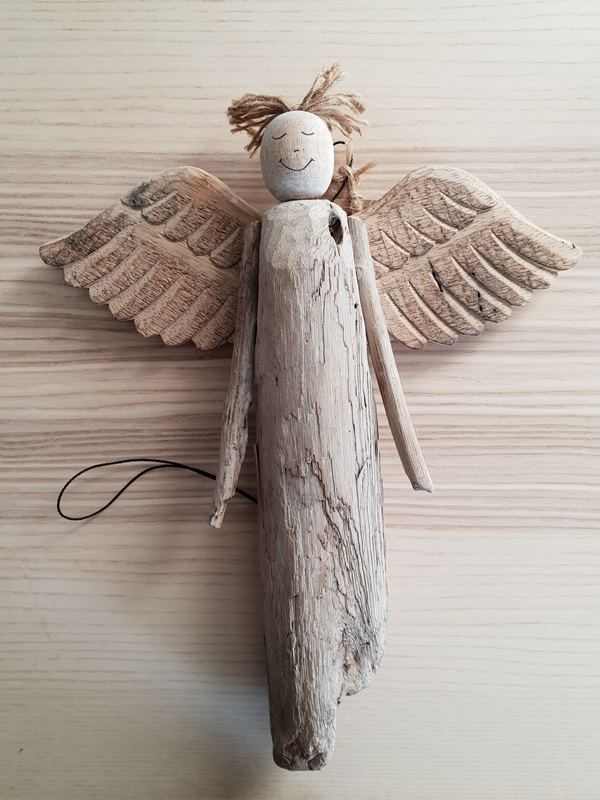 Wooden bali angels craftsmen handmade organic christmas sally bourne interiors london